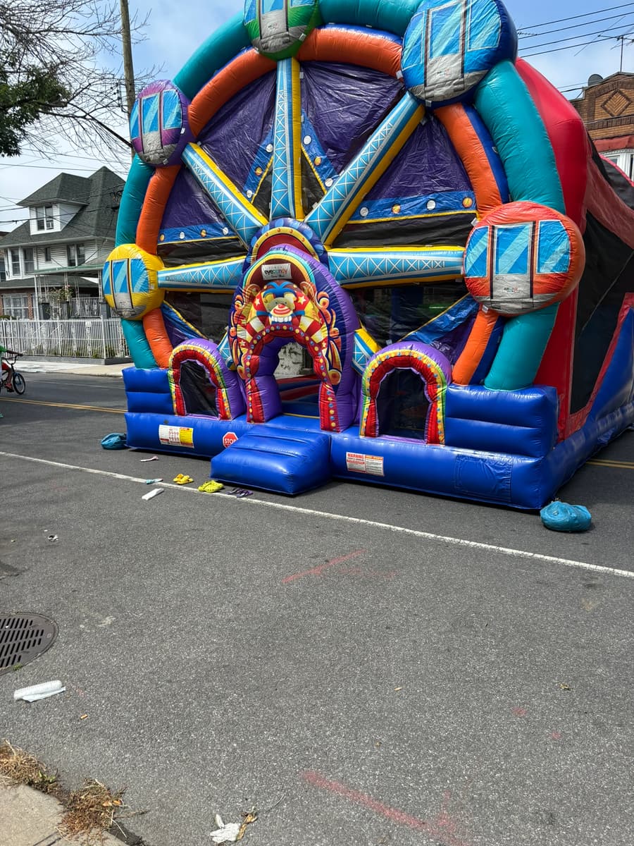 A bouncy house set up in the middle of Albany Avenue with the street closed to traffic